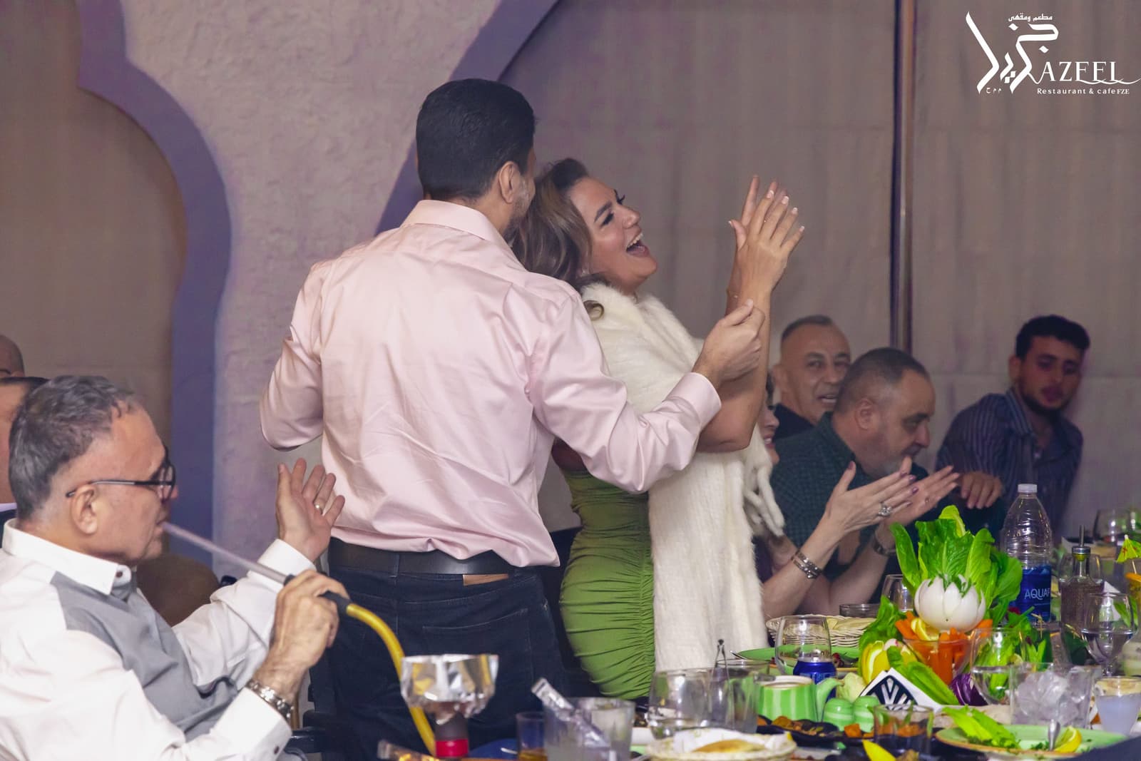 Guests celebrating together at the table