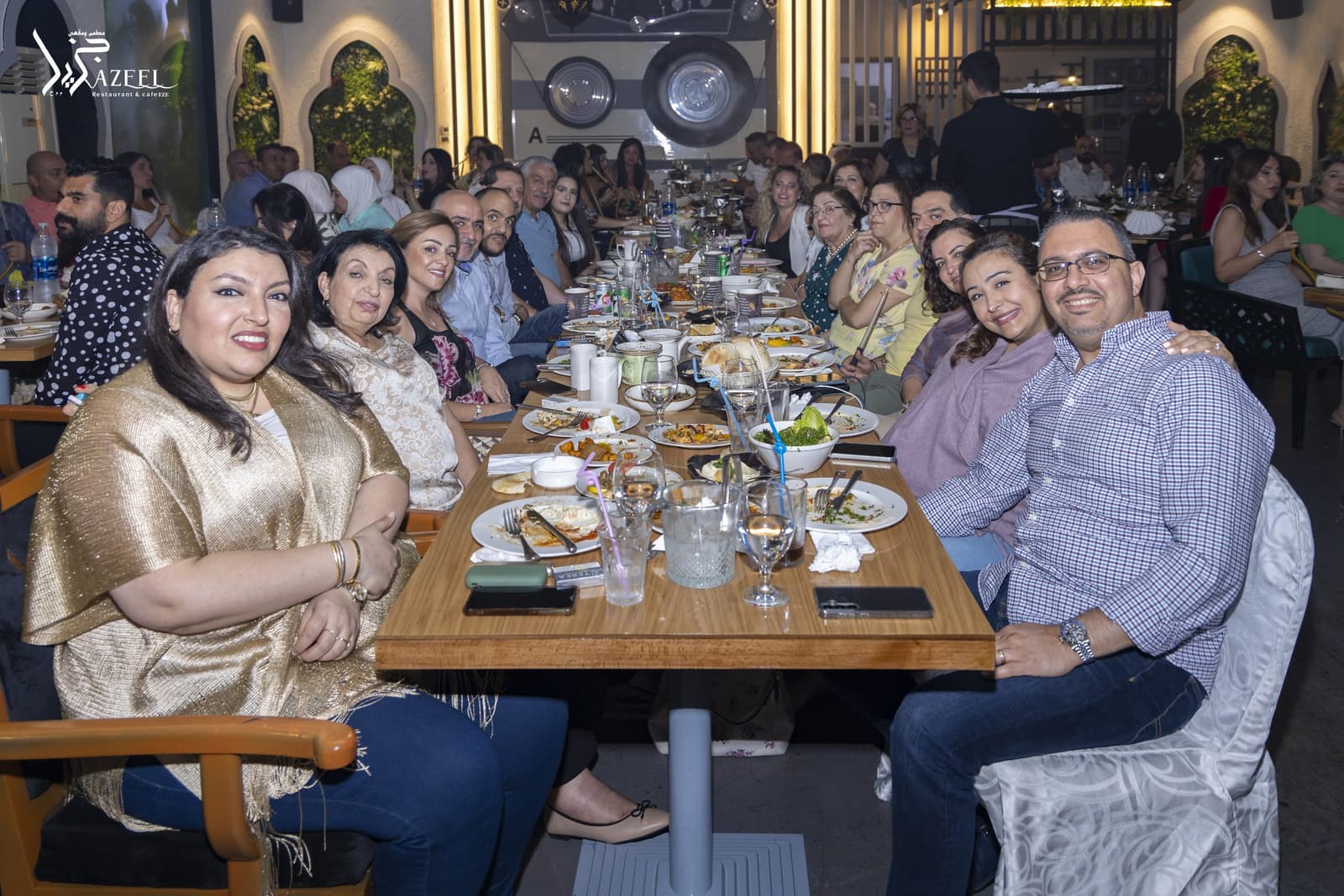 A long table of guests during a celebration